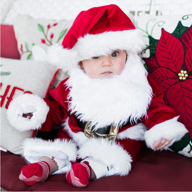 8 month old ellis in a santa outfit, beard and all